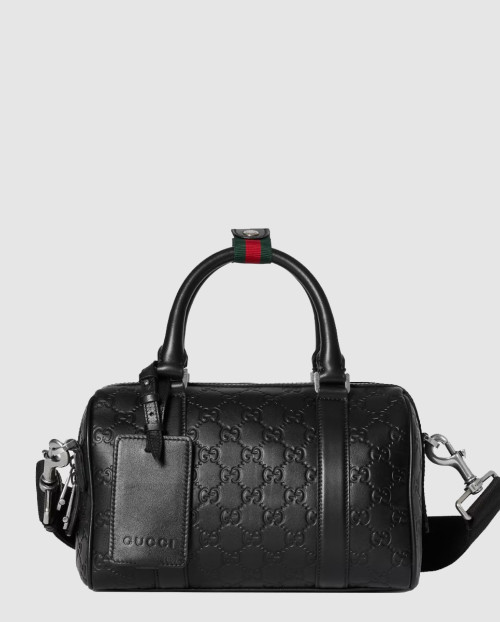 [GUCCI-구찌]작은 형식의 GG 엠블렘 여행용 855789
