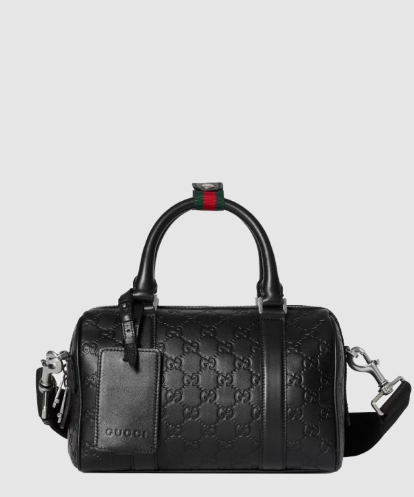 [GUCCI-구찌]작은 형식의 GG 엠블렘 여행용 855789